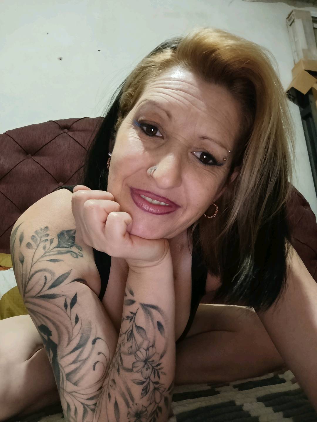 Woman in a natural webcam setting during a one-on-one video chat